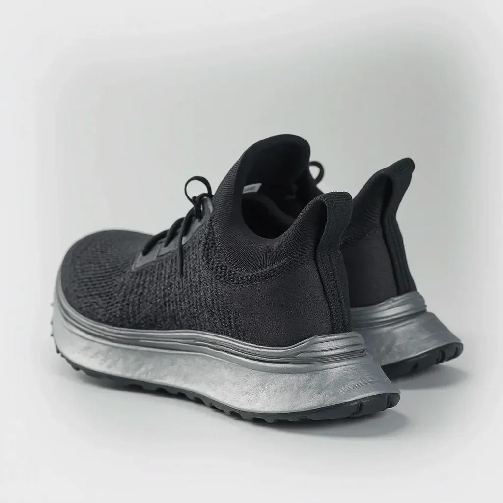 Close-up of the Velocity Pro running shoe's mesh upper, revealing its breathable build, stitching detail, and reactive midsole design