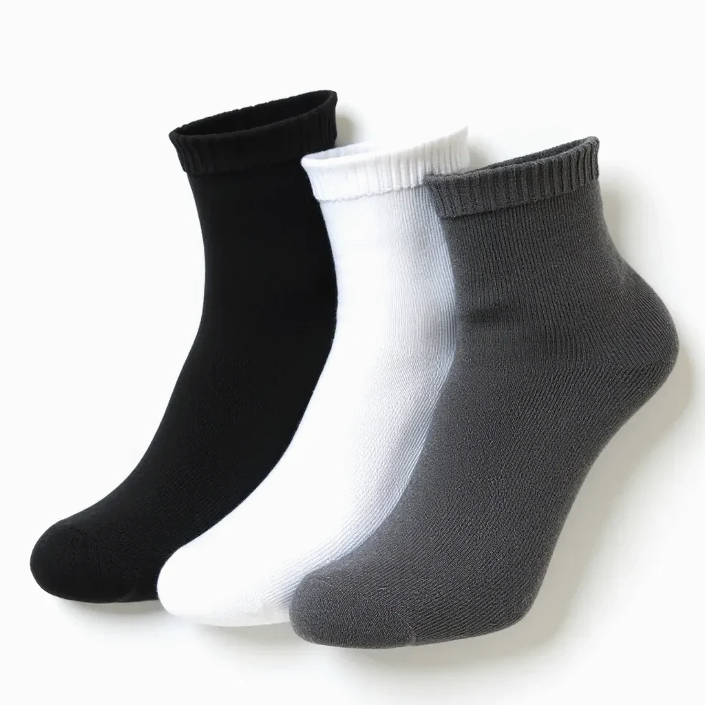 Three-pack of performance running socks folded neatly on a white background, showing the different color choices